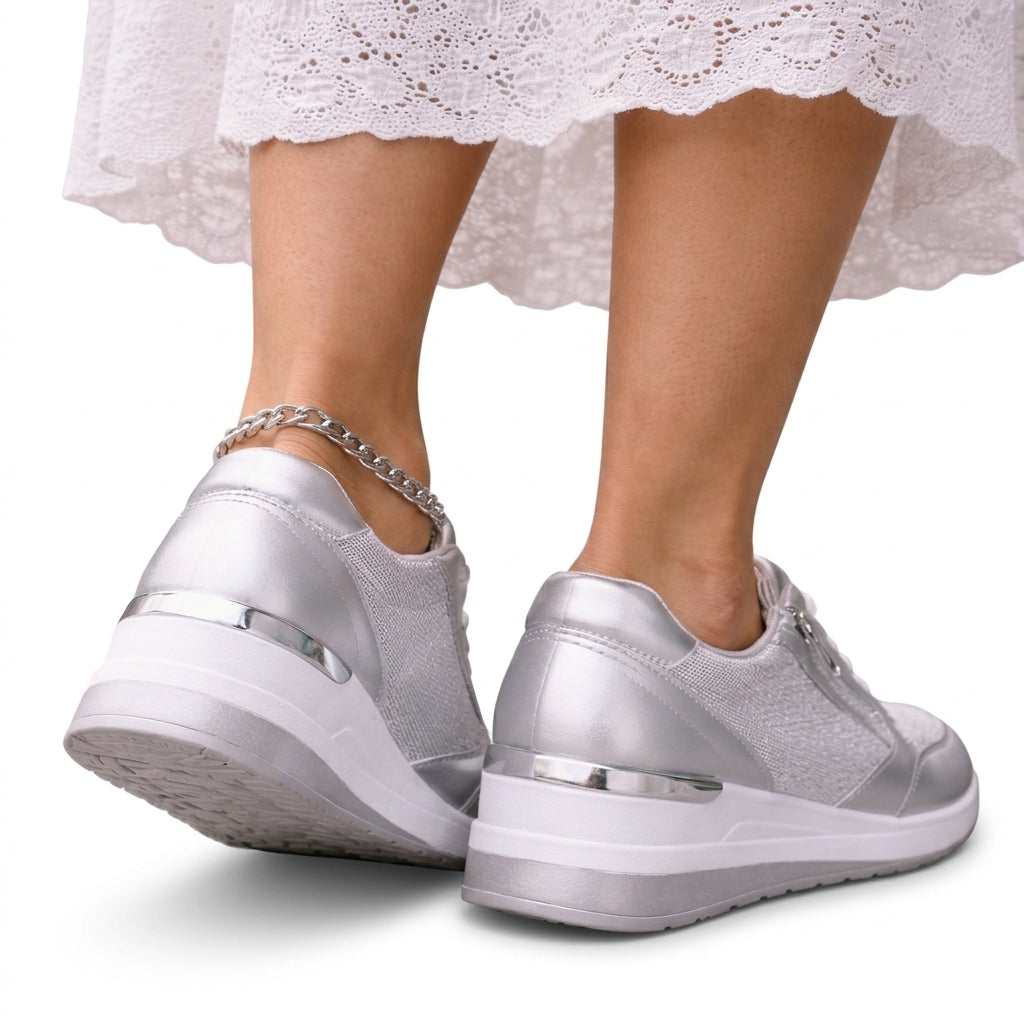 Silver platform sneakers with side zip, rear view showing the platform sole