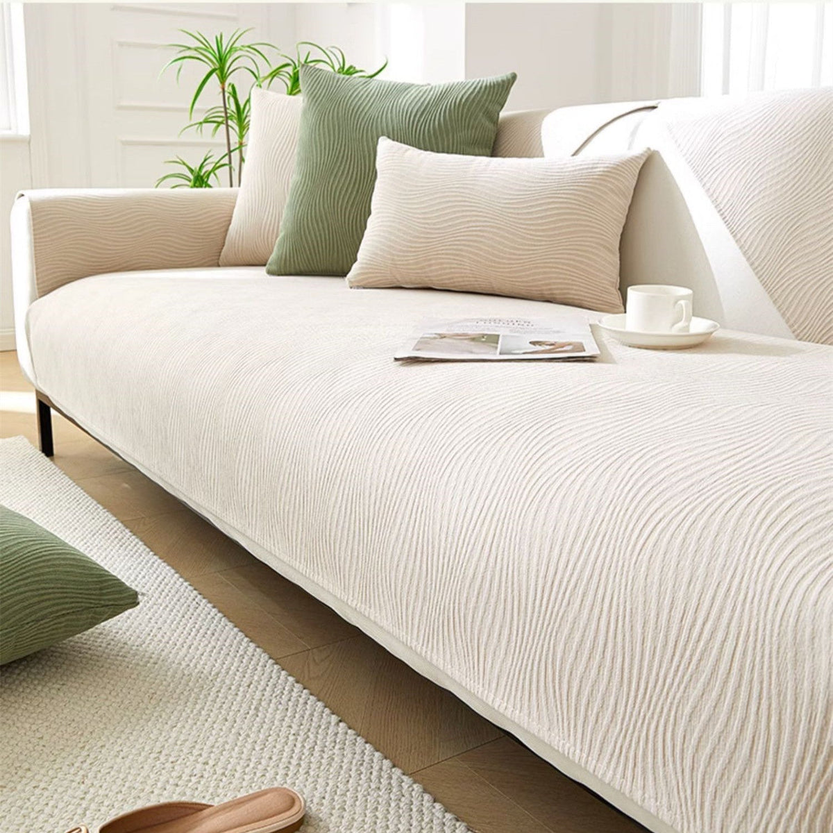 White textured fabric sofa cover over a sofa seat, back and armrest