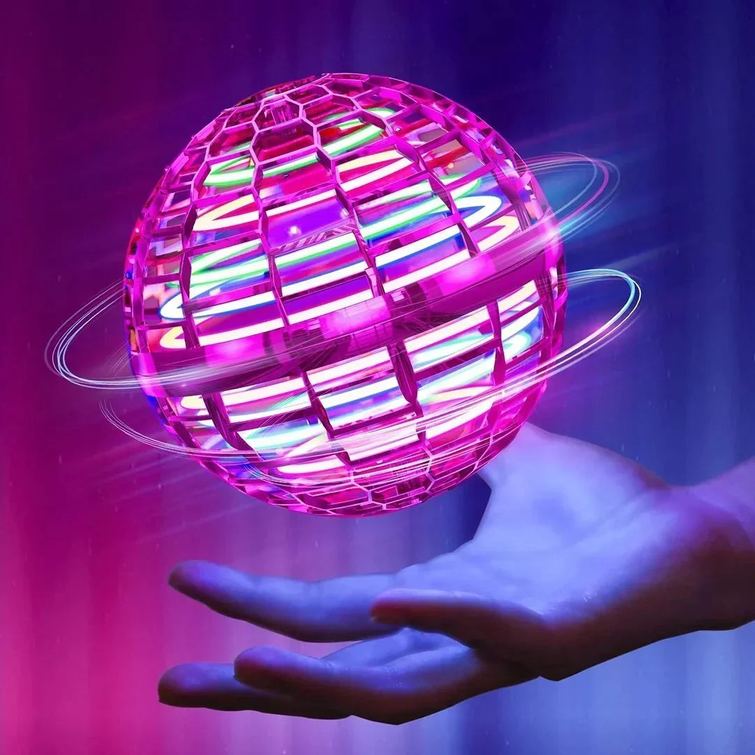Pink flying orb ball with colourful LED lights hovering above a hand