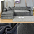 Grey velvet corner sofa cover in a modern living room with fabric texture close-ups