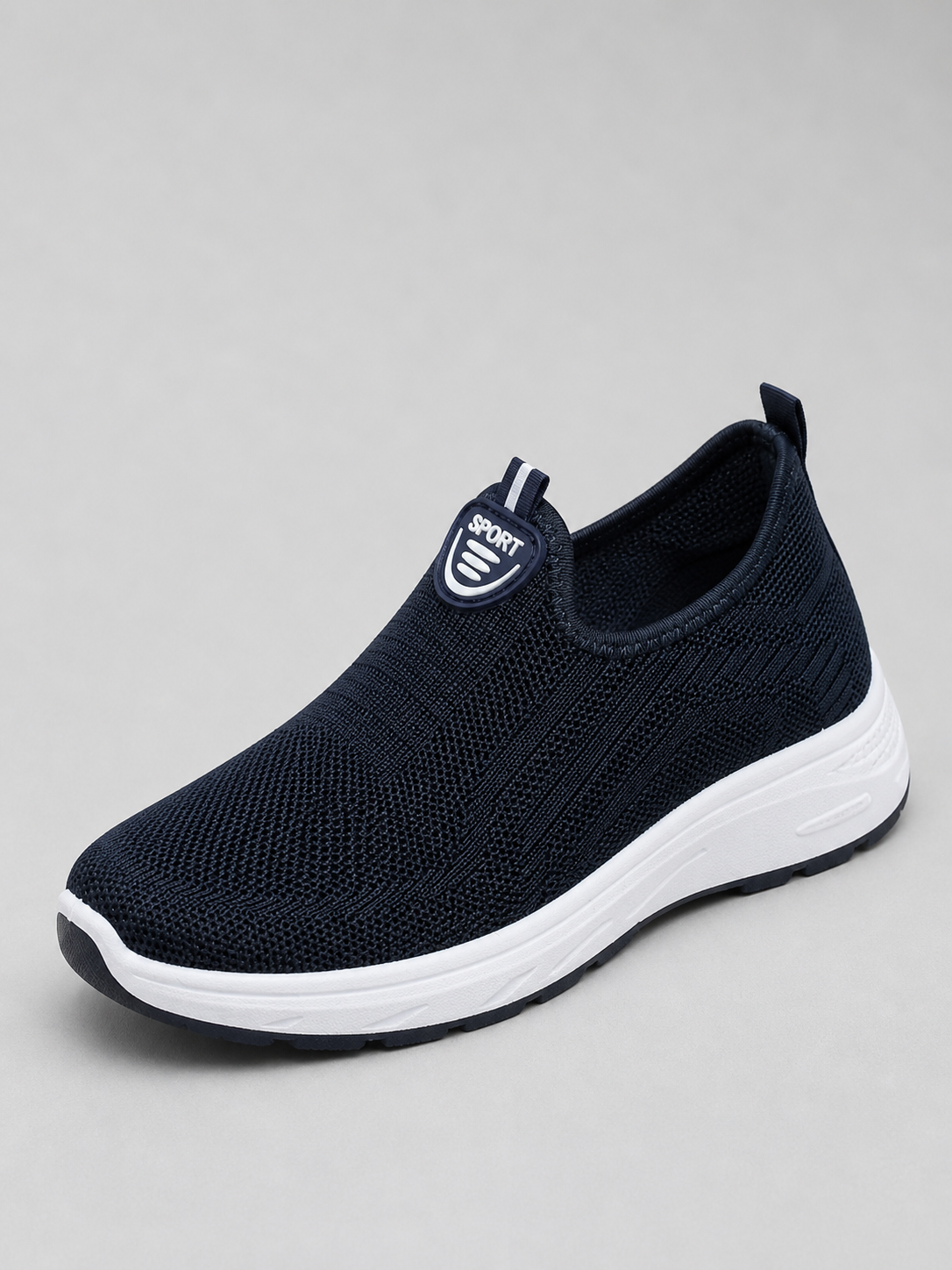 Navy slip-on knit trainer with a white sole