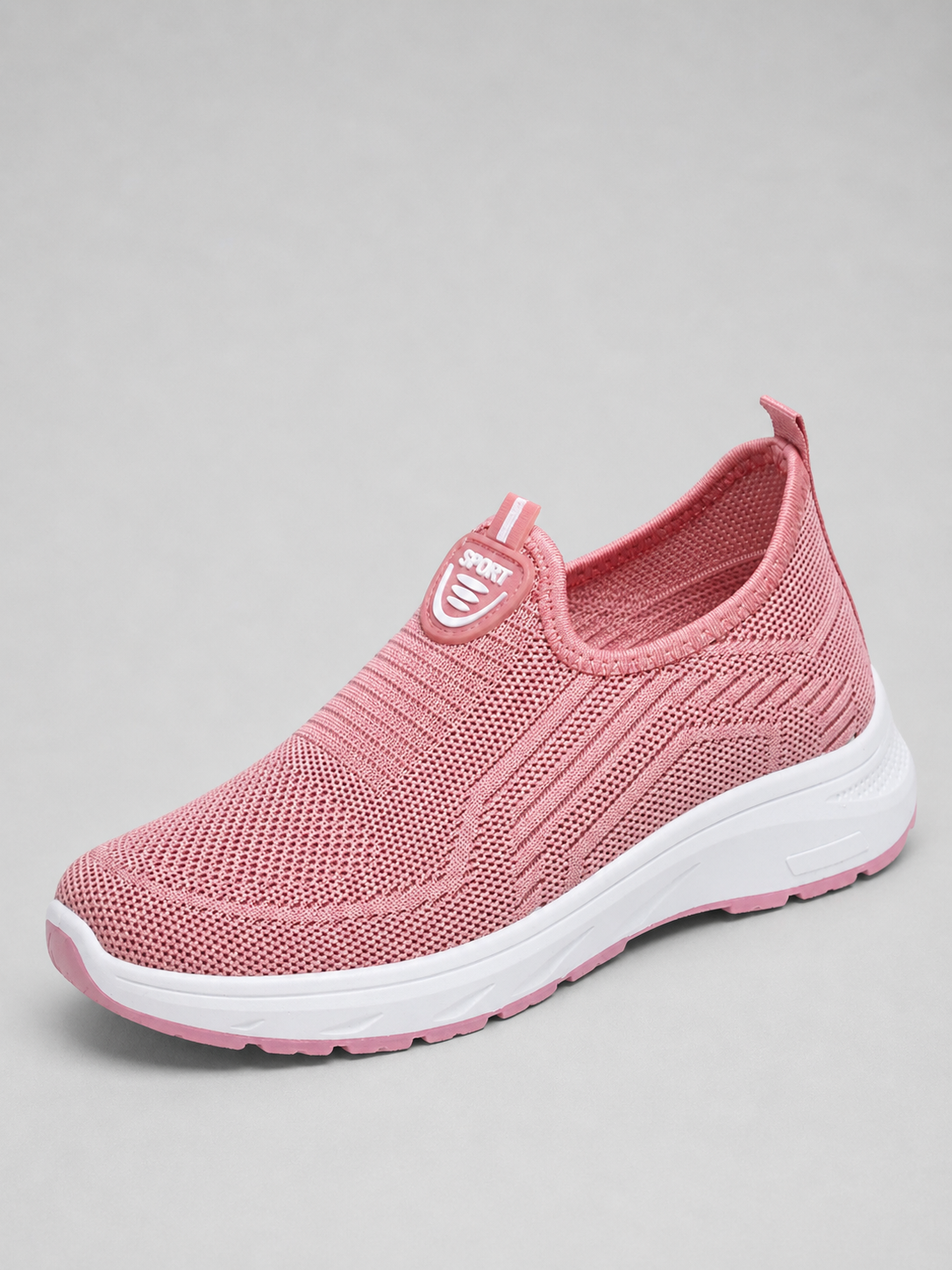 Pink slip-on knit trainer with a white sole