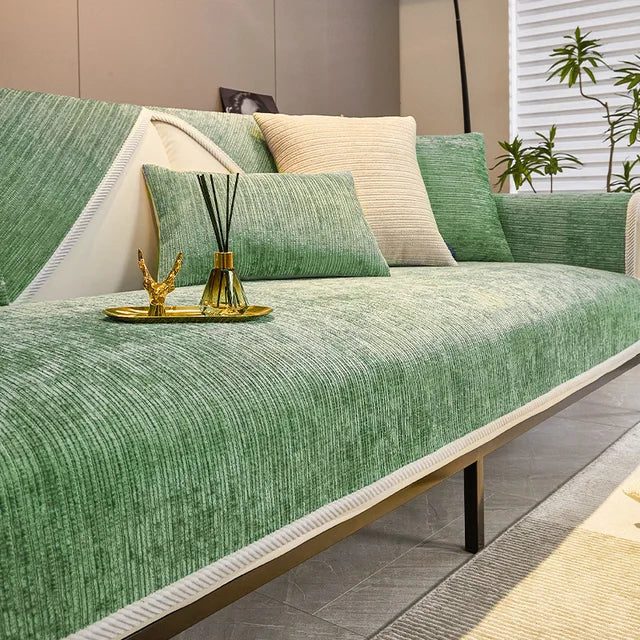 Green woven fabric sofa cover on a modern sofa with matching cushion covers