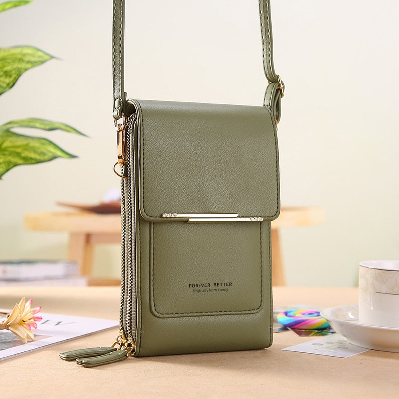 Green faux leather crossbody phone bag with gold-tone bar detail and adjustable strap