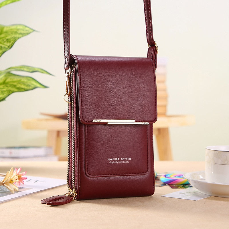 Burgundy faux leather crossbody phone bag with gold-tone bar detail