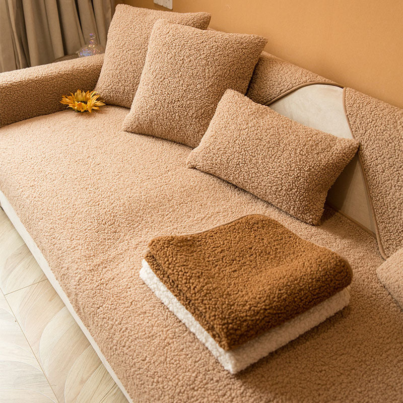 Light brown teddy fabric sofa cover with cushion covers, seen from above