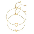 Two gold-tone chain bracelets with an open heart and a smaller solid heart detail