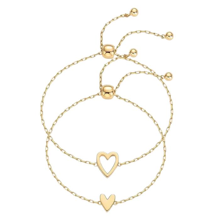 Two gold-tone chain bracelets with an open heart and a smaller solid heart detail
