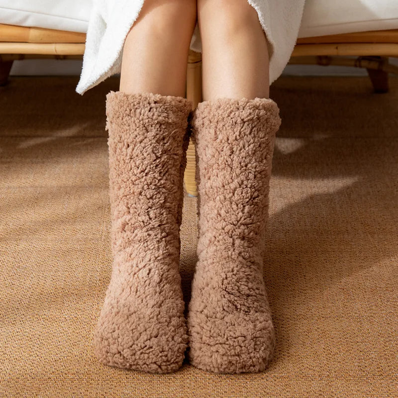 Front view of brown teddy fleece home socks worn indoors