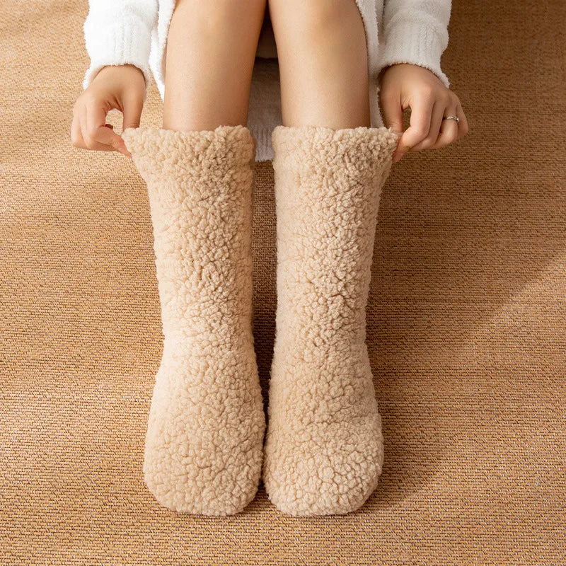 Light brown teddy fleece socks being pulled up at the top