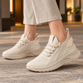 Women's breathable trainers in beige, platform trainers with sock collar and woven upper, worn outdoors