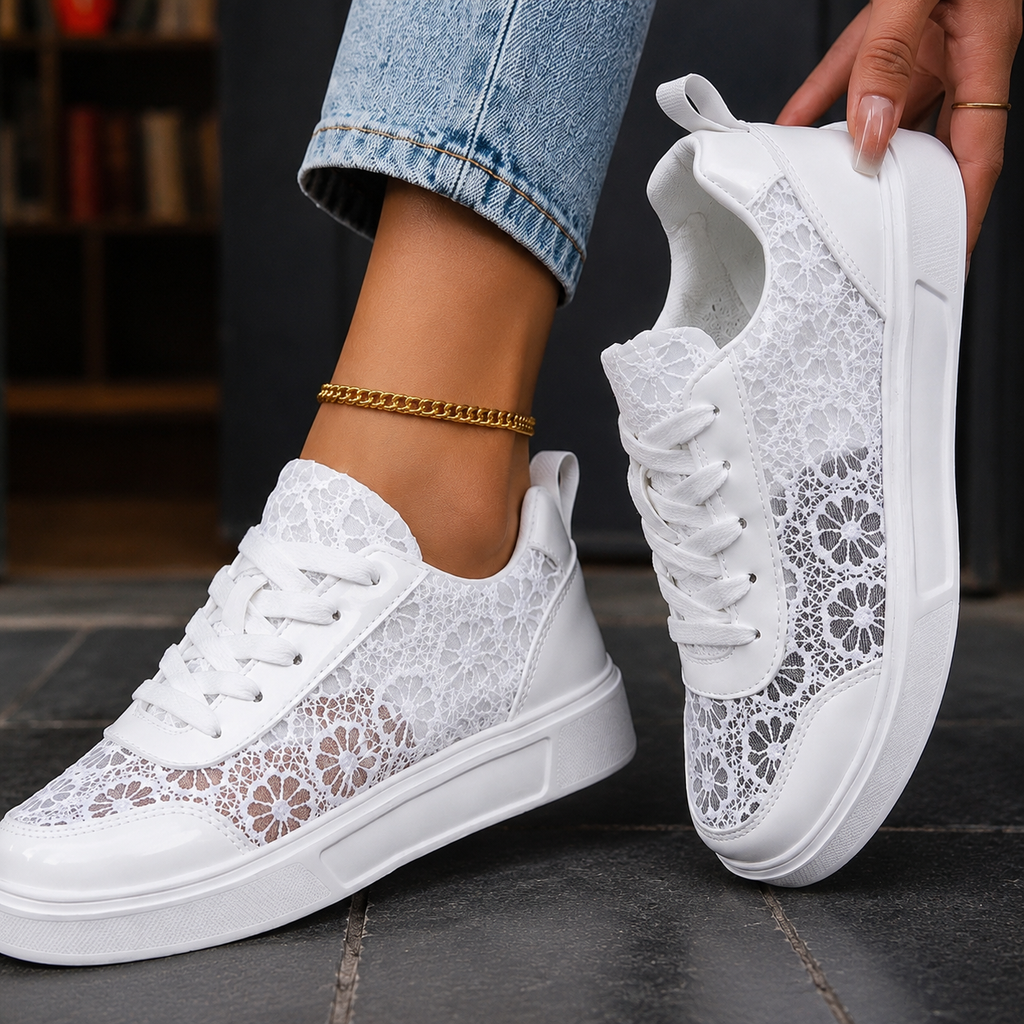 White lace sneakers for women with floral lace sneakers panels and a platform sneakers sole, worn with jeans