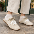 Cream backless sneakers for women, open heel sneakers and mule trainers with a gum sole, worn with cropped trousers