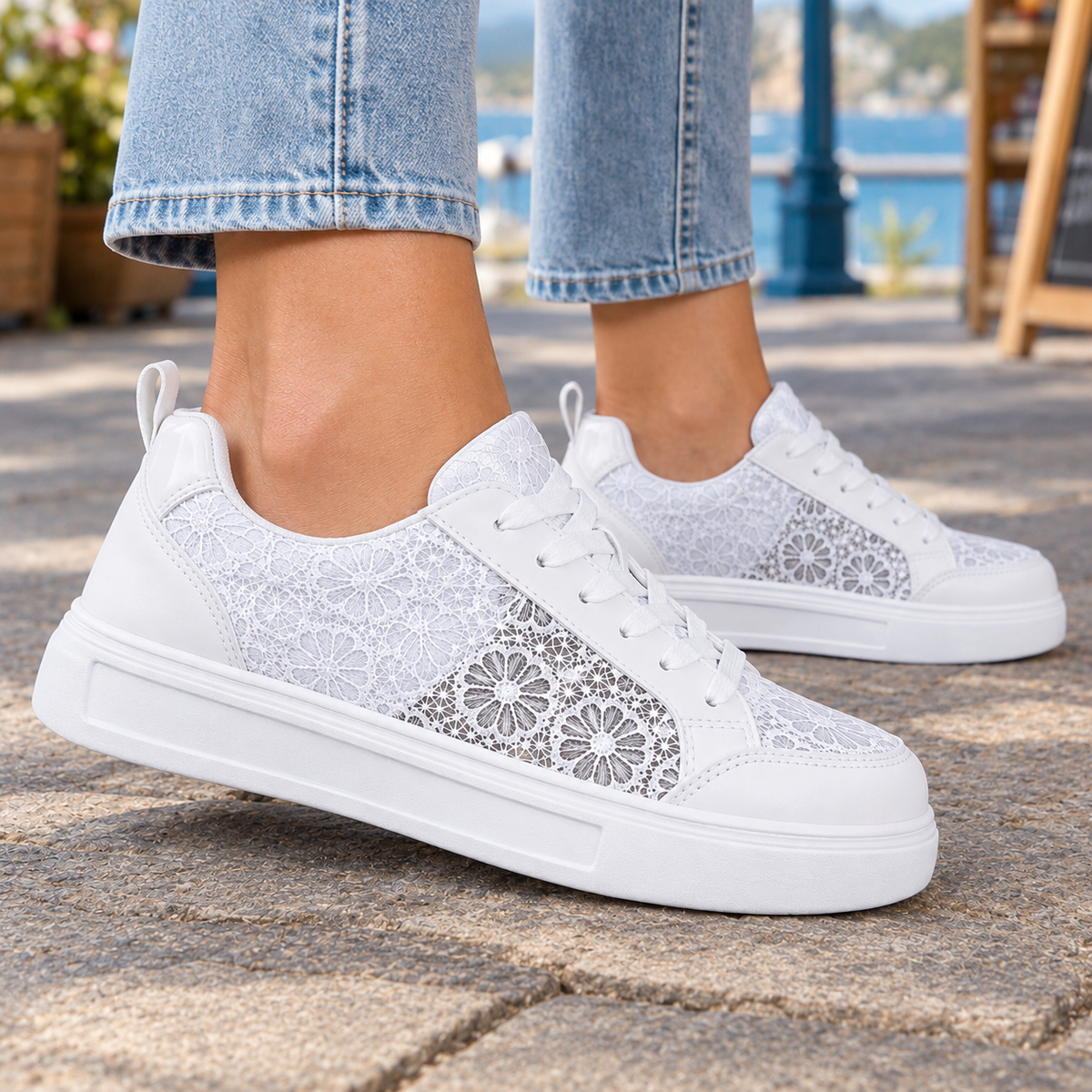 Side view of women's floral sneakers with level platform sole and padded back in white