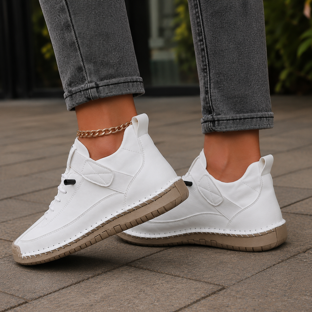 White lace up trainers with ankle strap and low-profile contrast sole, side view