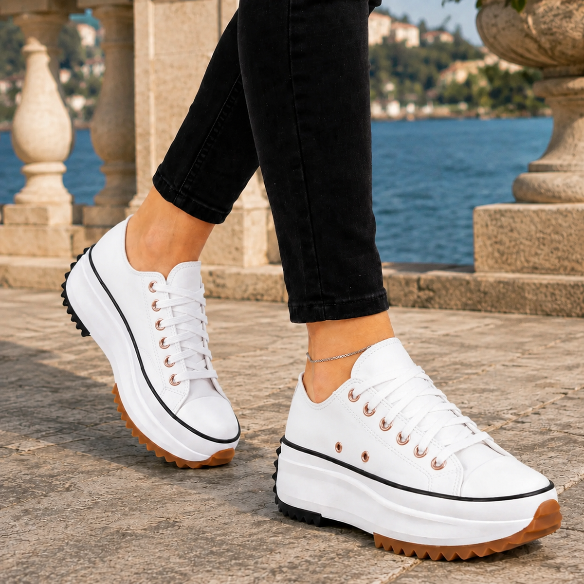 White lace-up low-top platform trainers with a reinforced contrast toe cap and chunky platform sole