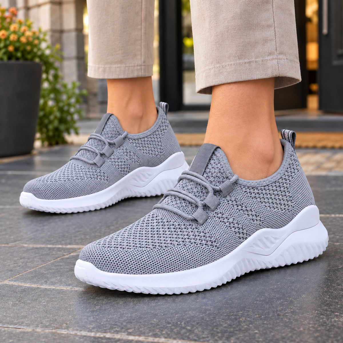 Grey mesh-knit trainers with elastic laces and a white low sole