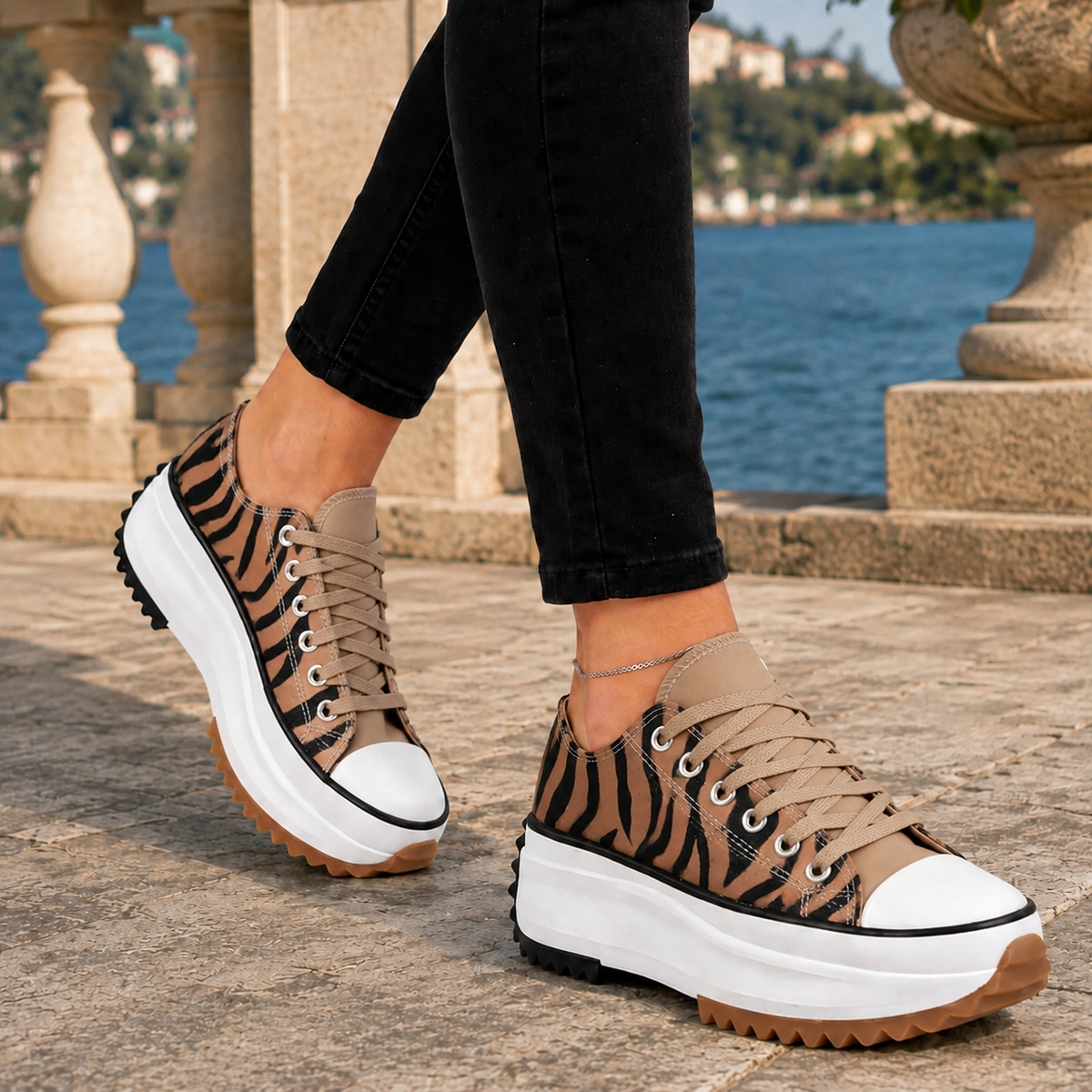 Zebra lace-up low-top platform trainers with a reinforced contrast toe cap and chunky platform sole