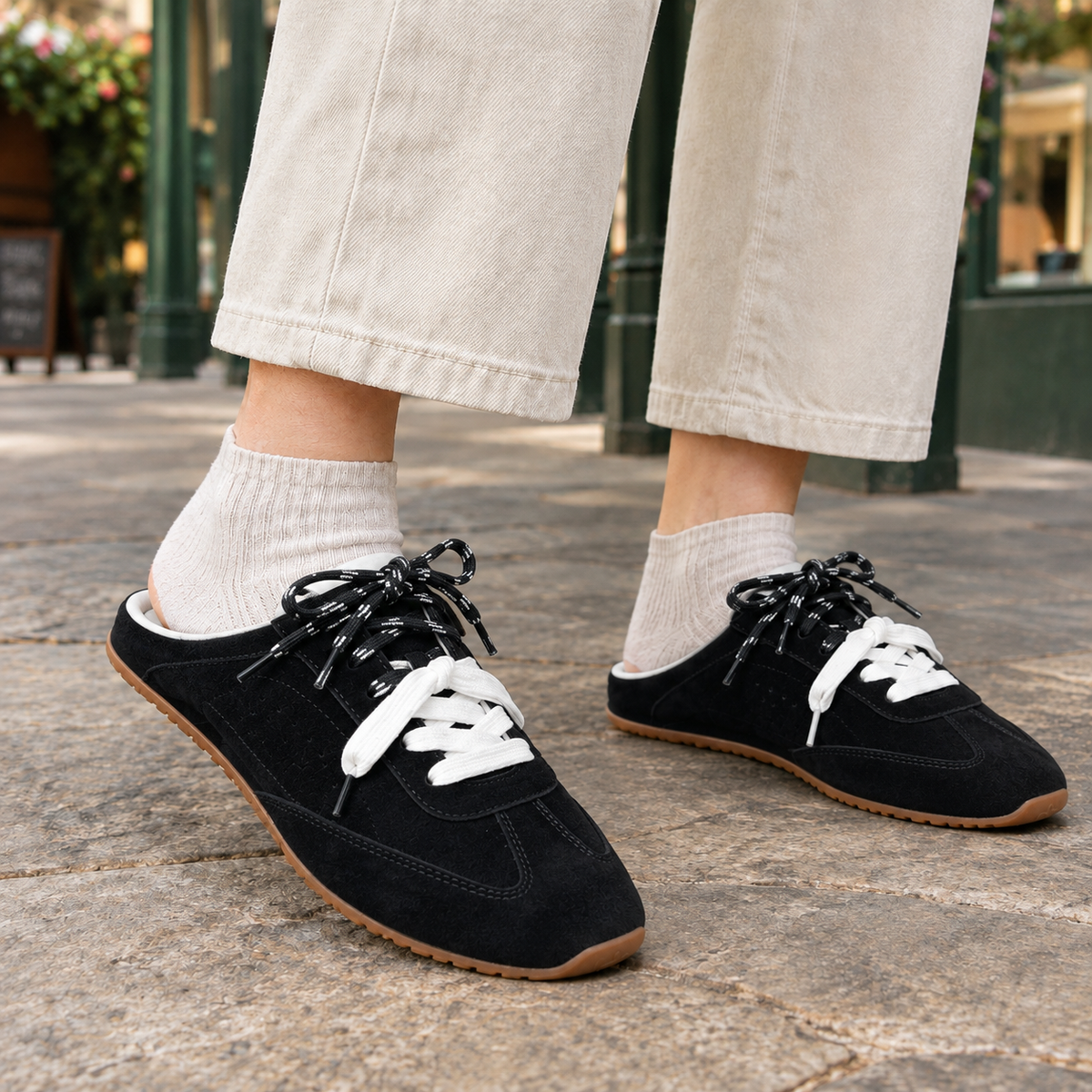 Black backless sneakers for women, open heel mule trainers with a flat gum sole
