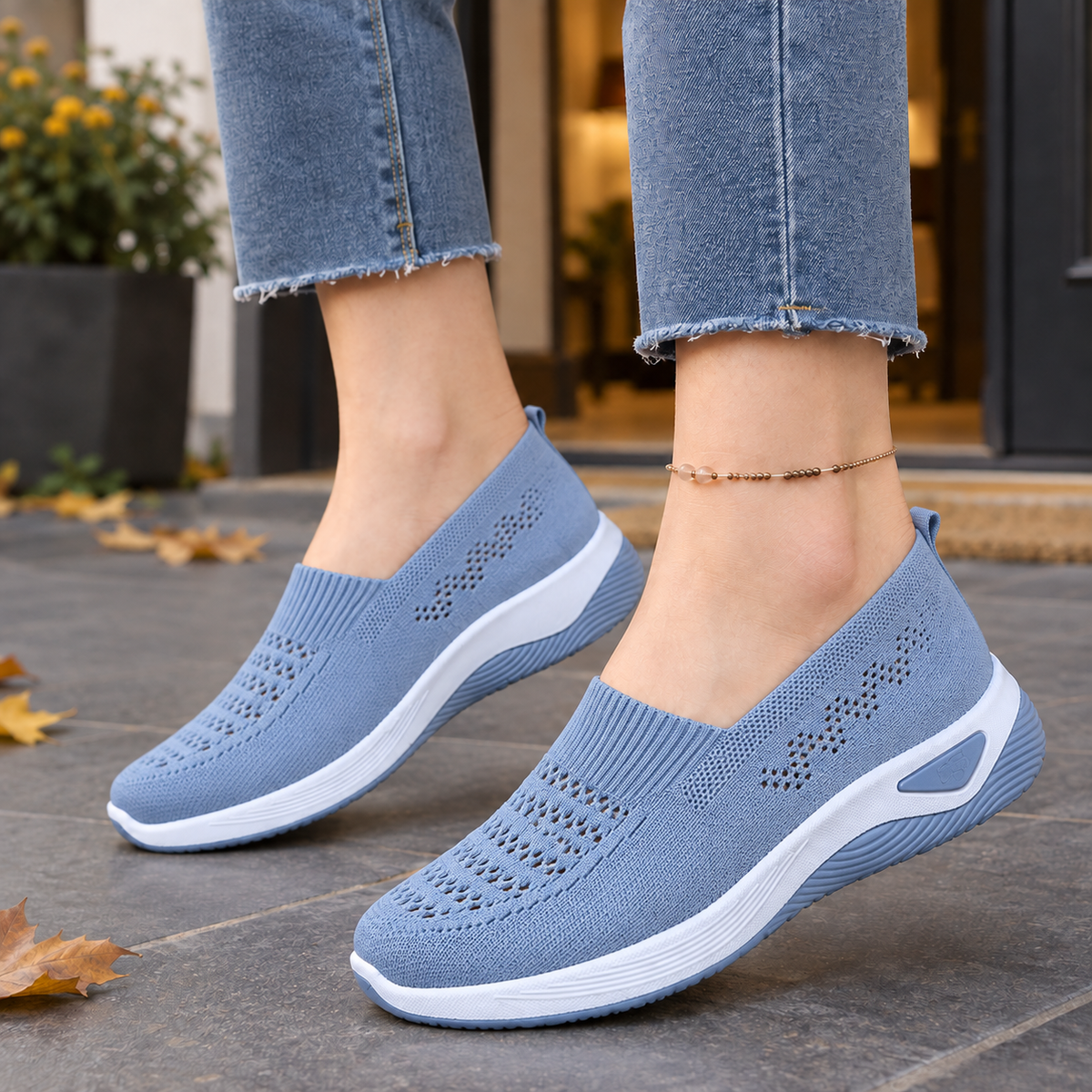 Blue breathable knit slip-on trainers with ventilated open-knit panels and a low raised sole