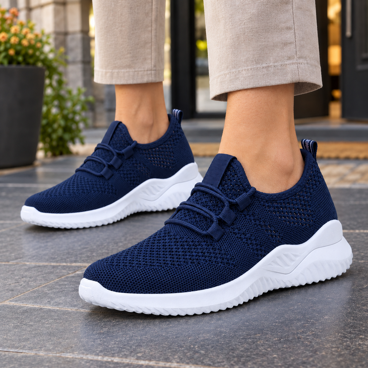 Navy mesh-knit trainers with elastic laces and a white sole