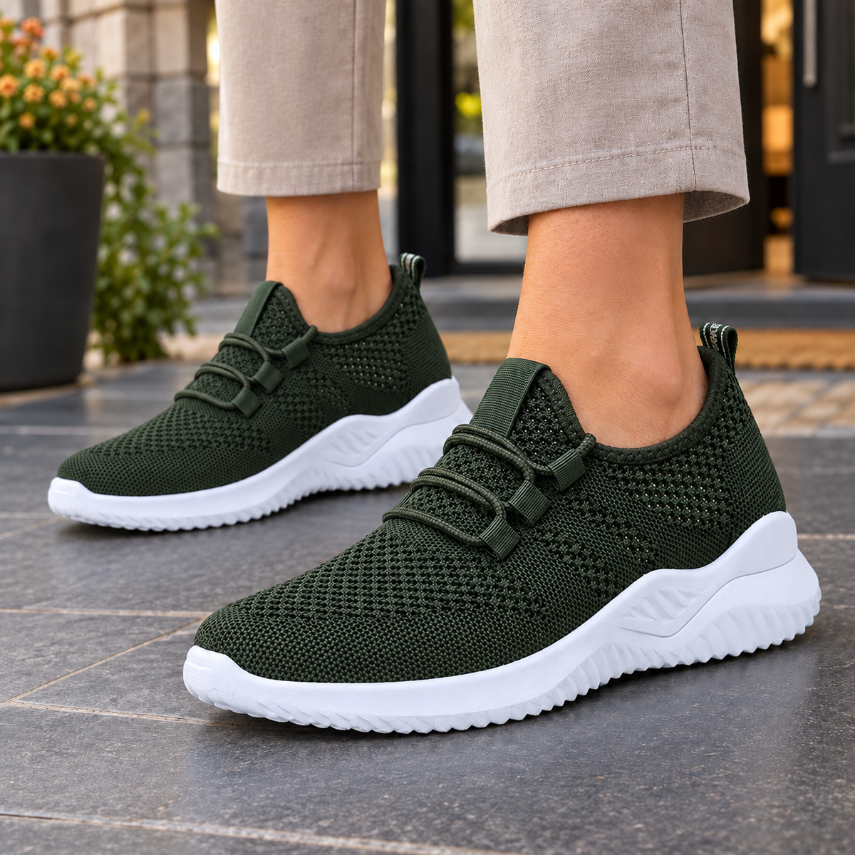 Dark green mesh-knit trainers with elastic laces and a white sole