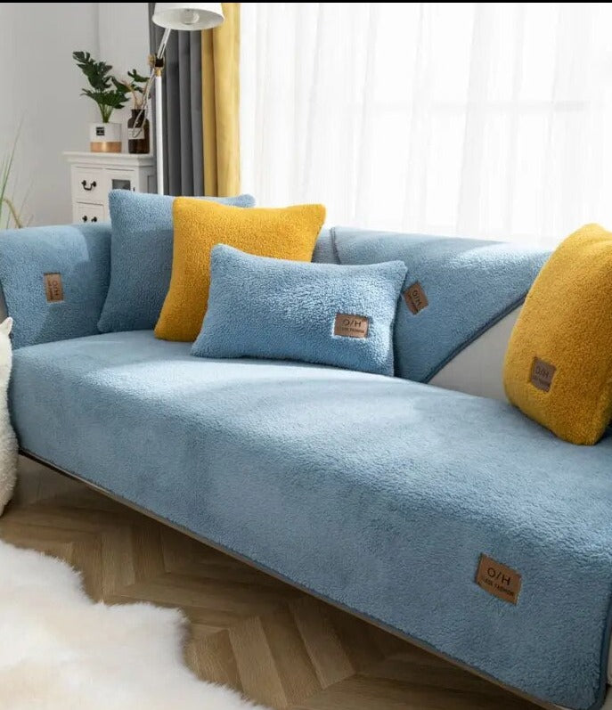 Blue teddy fleece sofa cover with blue cushion covers and yellow accent cushions
