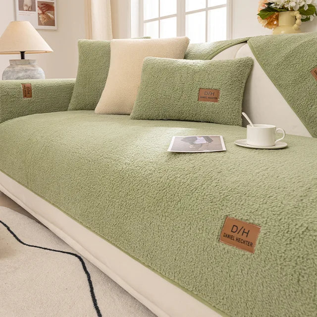 Light green textured teddy fleece sofa cover with matching cushion cover and a cup of tea
