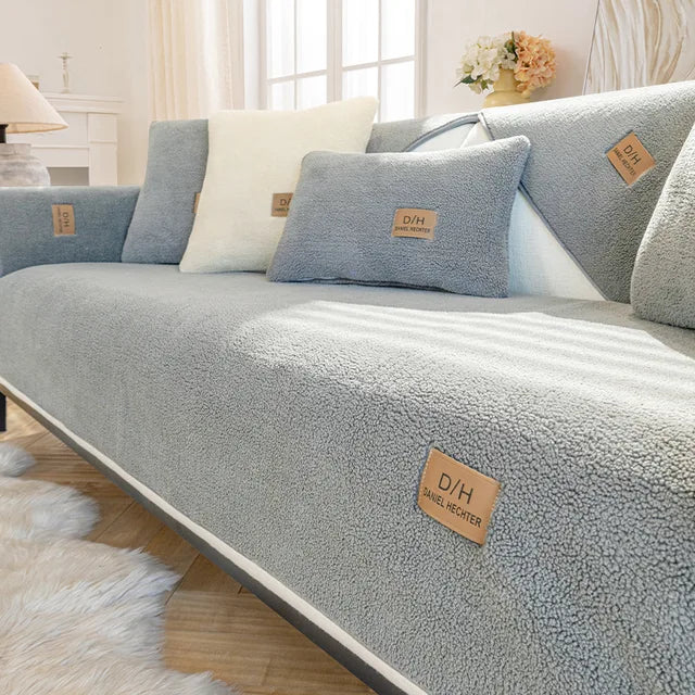 Grey teddy fleece couch cover on seat, back and armrest with coordinated cushions