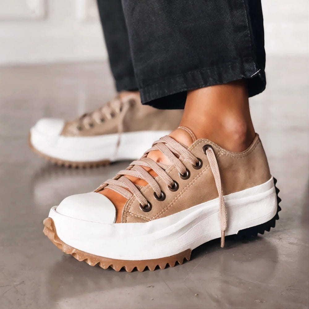 Khaki lace-up chunky platform trainers with a white sole and gum-coloured lugged outsole
